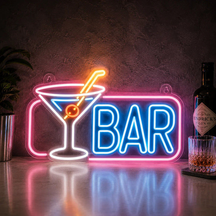 Bright martini cocktail neon wall sign with glowing blue BAR lettering and pink frame lighting for pub, lounge, or home bar decor.