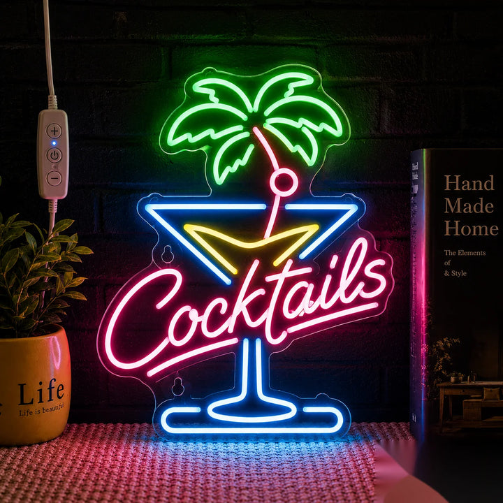 Bright cocktail neon wall sign featuring a tropical palm tree and martini glass design with vibrant pink, blue, and green LED lighting.
