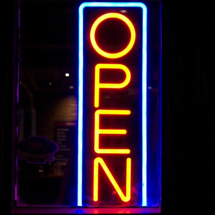 Vertical yellow and blue LED neon open sign for a business window