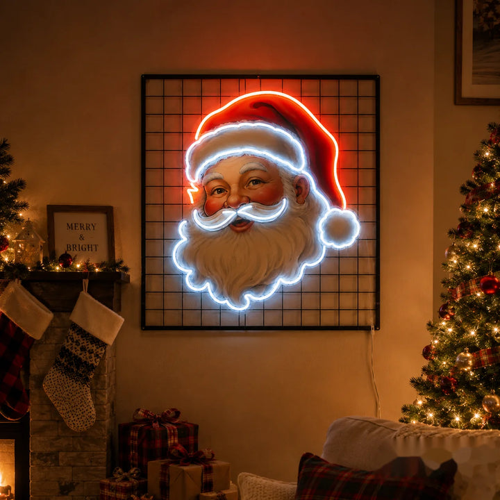 LED neon Santa Claus wall sign with red hat and cool white outline lighting mounted on black grid panel for cozy Christmas living room and holiday fireplace decor.