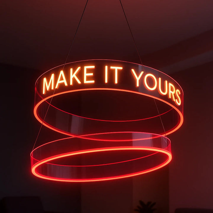 Custom red LED neon circle chandelier with two hanging rings and glowing “MAKE IT YOURS” lettering.